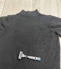 Sweater With Just A Razor And Lint Roller