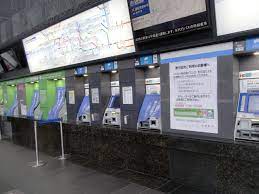 File:Because Neocorona by shutout ticket machines in Kyoto Station.jpg -  Wikimedia Commons