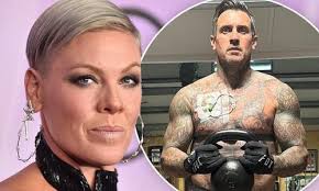 Pink's husband Carey Hart lifts weights as he has a catheter installed in  his chest: 'My old & infected self is still getting after it'