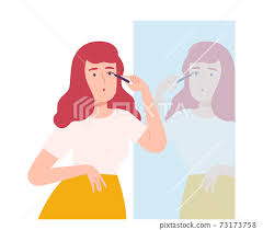 young woman applying mascara while