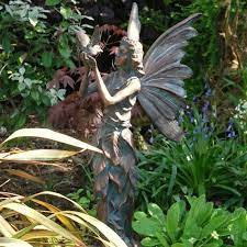 bronze effect standing fairy and bird
