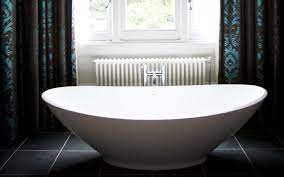 Person's feet on white bathtub HD ...