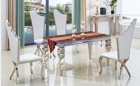 Find modern dining chairs as dashing as the table itself. China Small Glass Dining Table And 4 Chairs Infinity White Leather Stainless Steel X Deco Chairs China Metal Restaurant Chairs White Dining Chairs