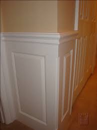 There should be a seamless transition around the corner. Wainscoting Mitre Contracting Inc
