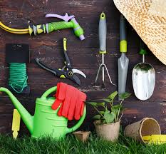 Gardening Tools On Old Wooden Wall In