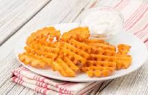 How do waffle fries get cut?