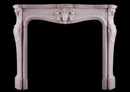 A Statuary Marble Fireplace In The