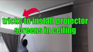 a projector screen on ceiling in studs