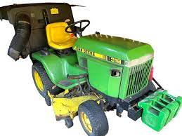john deere 318 riding lawn mower with a