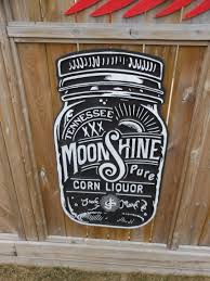 XXX MoonShine sign. made from barn boards and pallet materials.