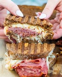 Filled with corned beef, swiss cheese, thousand island dressing, and sauerkraut you can't rest going back for another taste. Reuben Sandwich Jo Cooks