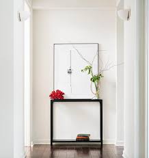 sleek black console table with art