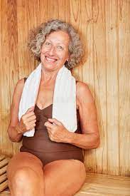Old woman relaxes in sauna stock image. Image of wellbeing - 193693313