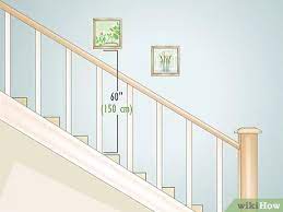 Follow the stairs when you hang pictures and do not hang pictures all in one row over one particular stair. 6 Ways To Hang Pictures Over A Staircase Wikihow
