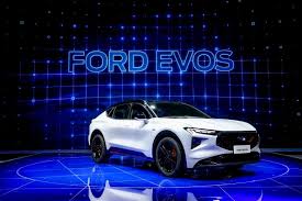 A visitor looks at the nio eve concept car displayed during the shanghai auto show in shanghai on monday, april 19, 2021. All New Ford Evos Ev Debuts At Shanghai Auto Show In China