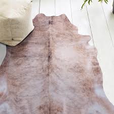 Cowhide doesn't stain, is a breeze to clean and your can pretty much shake it out and it's good to go. Grey Beige Neutral Color Faux Cowhide Print Animal Friendly Floor Rug Rugaustralia