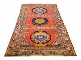 antique geometric light red khotan rug