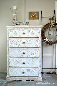 white and gold distressed damask dresser