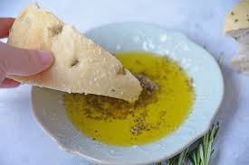 focaccia bread in olive oil bread dip