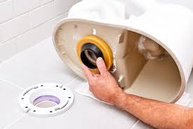 how to fix a toilet leaking at the base