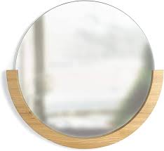 Mirrors are a subtle and effortless way of bringing depth and a touch of character to your living space. Amazon Com Umbra 358778 390 Mira Wall Mirror Decorative Mirror For Entryway Circular Mirror With Wood Frame On The Bottom Half Natural Finish 22 5 Diameter X 21 Height X 1 Width Home Kitchen