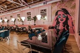 pink dining room and slick speakeasy lounge