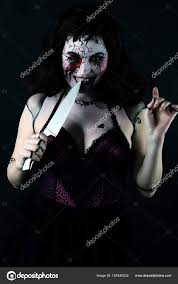 model with makeup scary doll with knife