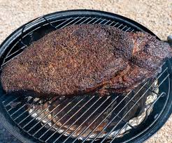 small brisket on a charcoal smoker