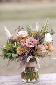 It looks like someone made a deliberate incision, stuck a seed inside, and sewed it back up. Mauve And Sage Green Bridal Bouquet Flower Delivery Unique Flower Arrangements Wedding Flowers