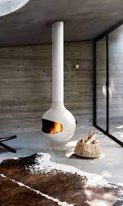 A local painter was looking for ideas how to hang on a fireplace without damaging the wall. Bathyscafocus Focus White Central Swivel Hanging Fireplace Modern Fireplace Hanging Fireplace Contemporary Fireplace