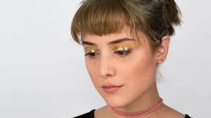 gold glitter eye makeup festival look