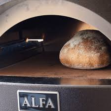 baking bread in a wood burning oven at