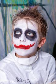 a boy with a scary makeup for halloween
