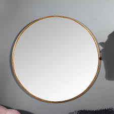 large round gold framed wall mirror