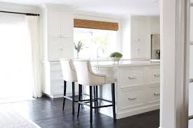 white kitchen with dark wood floors
