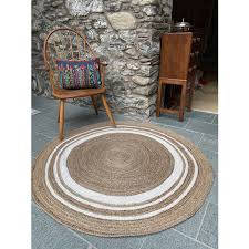 khidakee round border beige rug with