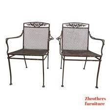 pair vintage woodard daisy arm chairs