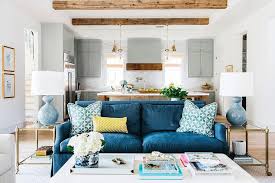 denim blue sofa with blue pillows