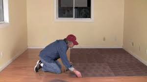 put carpet tiles on laminate flooring