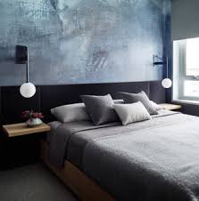 75 gray floor bedroom with blue walls
