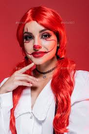 smiling woman with clown makeup