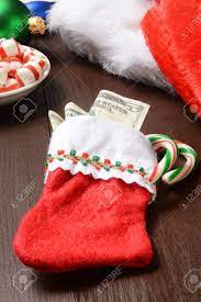 Keepsake stockings for the kids, bulk packs of mini stockings for holiday giveaways, and cute favors and toys to stuff in the stockings you buy. A Christmas Stocking Filled With Money And Candy Canes Stock Photo Picture And Royalty Free Image Image 33809705