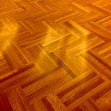 modern parquet wood flooring is cutting
