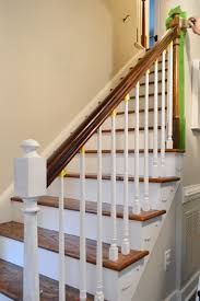 Previously we had a board with hooks on the right wall behind the door (when the door is open) and a row of short hooks on the half wall below the railing for . How To Install A Stair Runner Yourself Young House Love