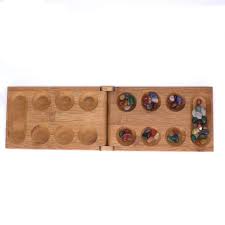mancala board game with stone pebbles