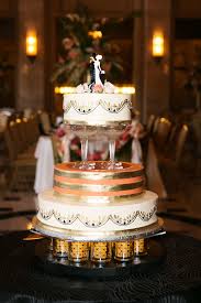This four tier wedding cake with a 4″, double height 6″ square and 8″ base will serve approx. Gatsby Inspired Wedding Cake