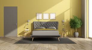 modern bedroom with yellow walls black