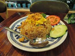 In thailand, fried rice along with basil chicken (or other variations), are dishes that nearly every stir fry restaurant serves, especially common at street food stalls. Fried Rice Wikipedia