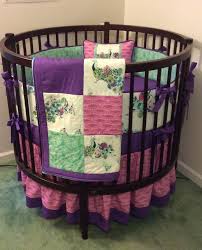 round crib bedding set teal pink and