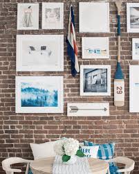 gallery wall on exposed brick walls